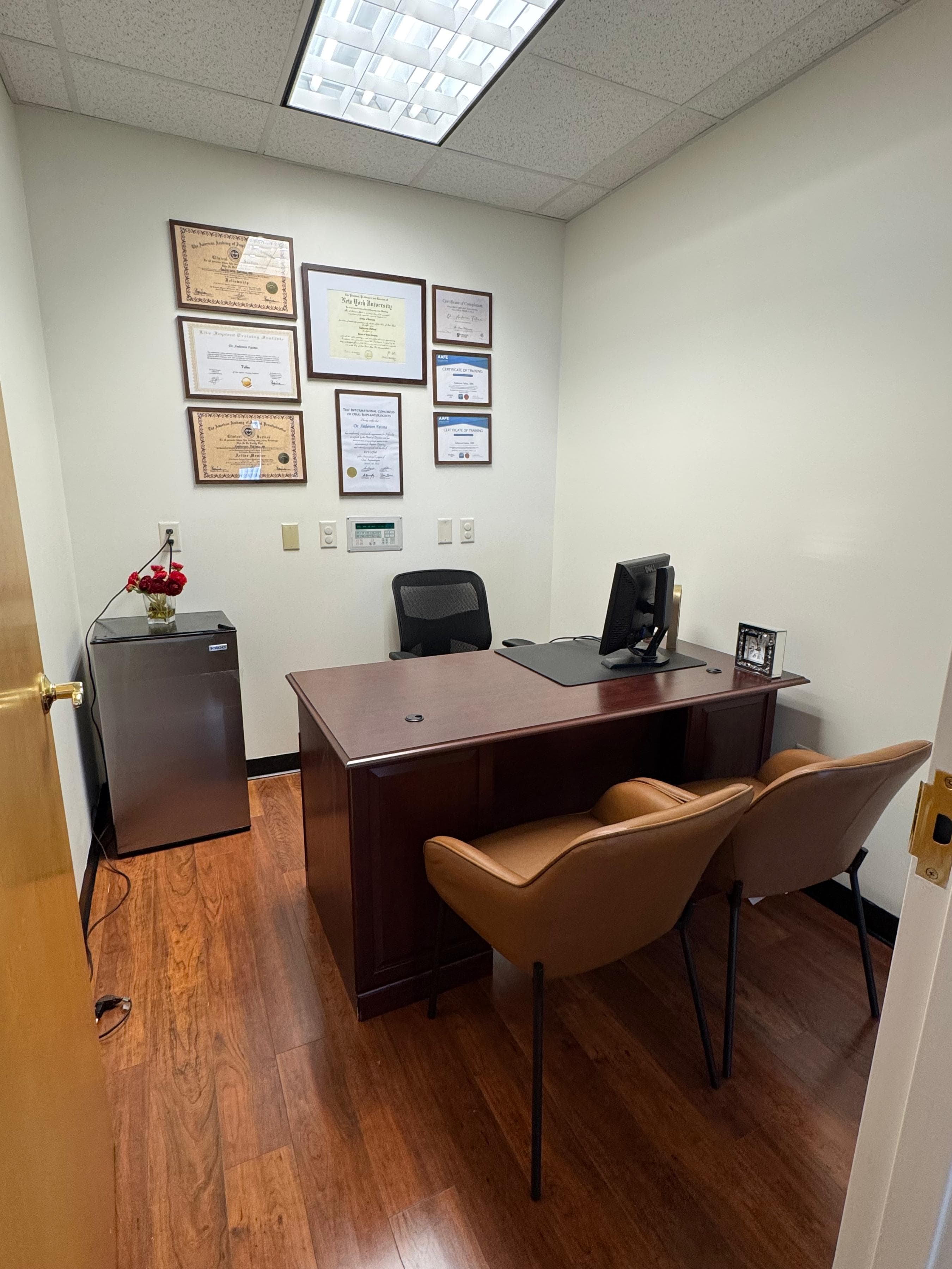 Consultation room with desk and chairs