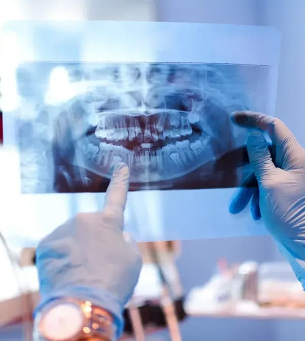 Digital dental X-ray sensor capturing imagery chairside.