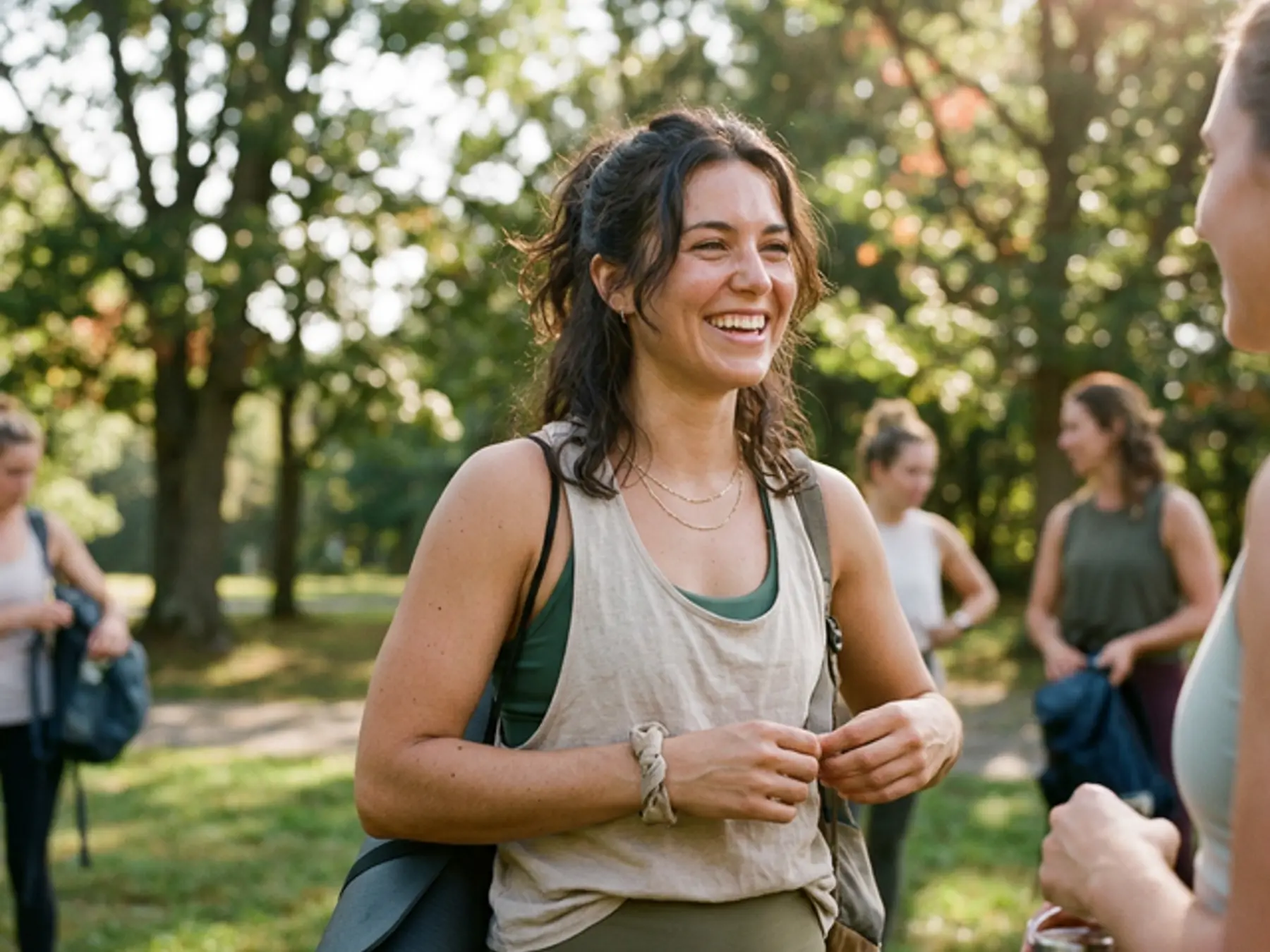 Active woman outdoors with a straight, confident smile after Invisalign treatment in Marlborough