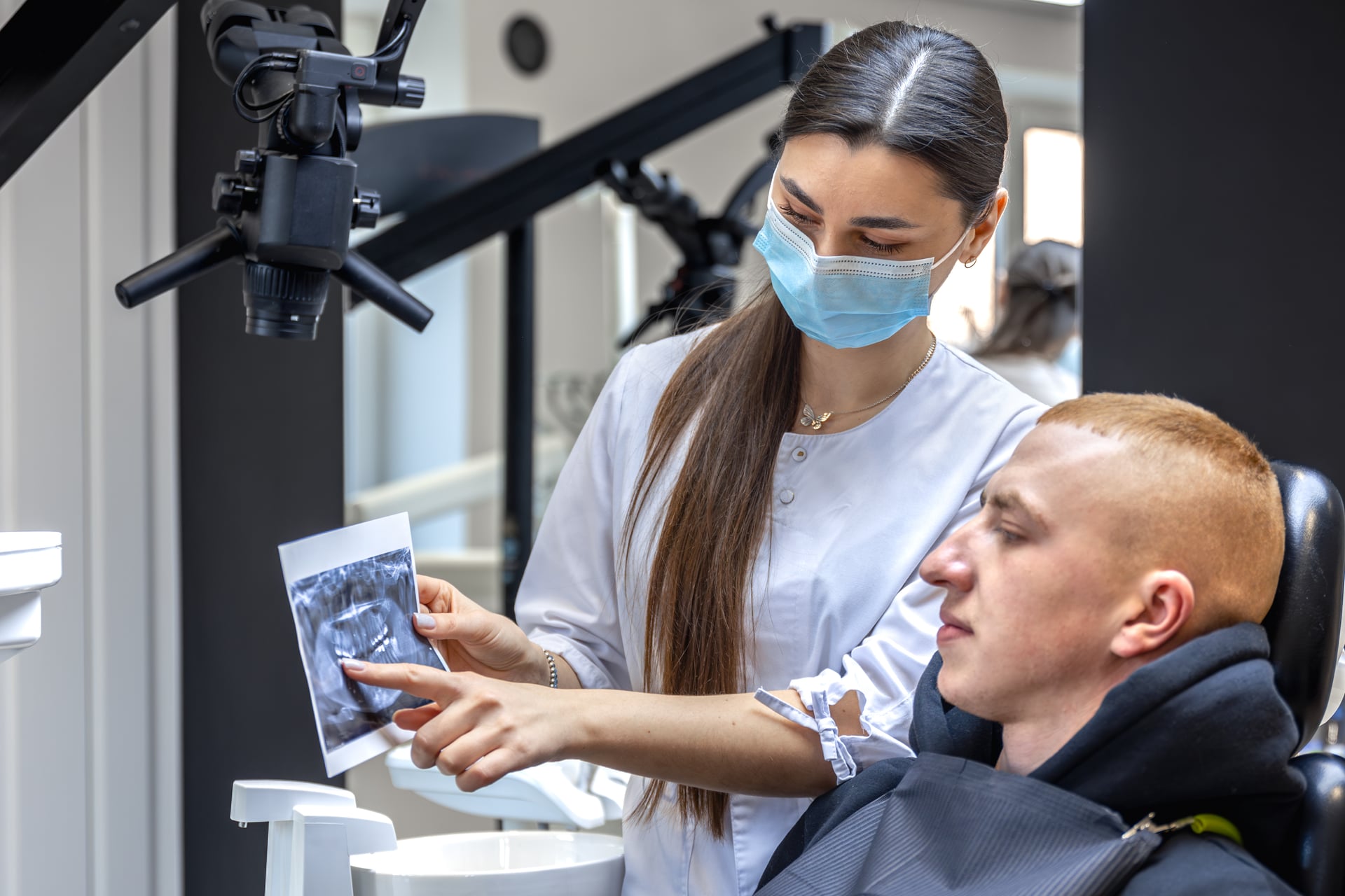 Dentist reviewing detailed treatment plan with precision and conservative approach